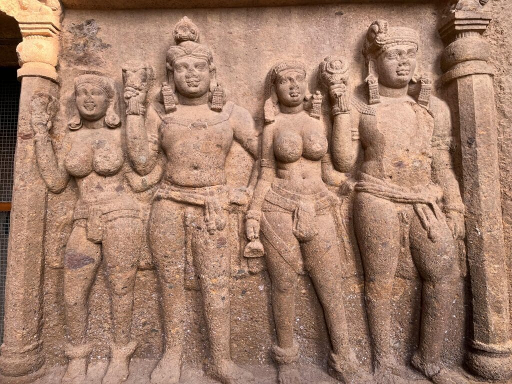 Detailed stone carvings depicting historical figures at Kanheri Caves in Mumbai.