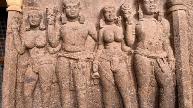 Detailed stone carvings depicting historical figures at Kanheri Caves in Mumbai.